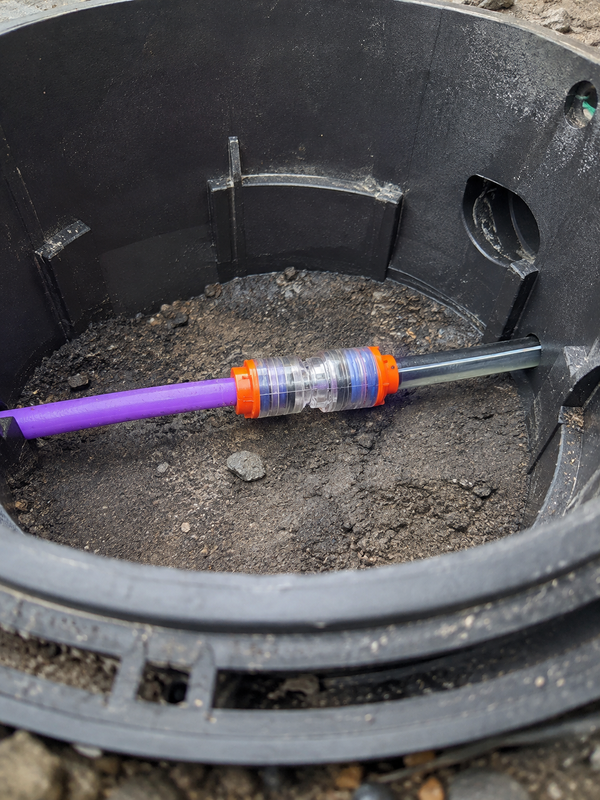 Outdoor telecom pedestal application for a microduct reducer connector